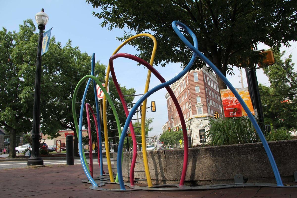 Ribbon Rack (Bike Rack), depicting colorful ribbons flying into the sky, appearing as if they're floating in the breeze.