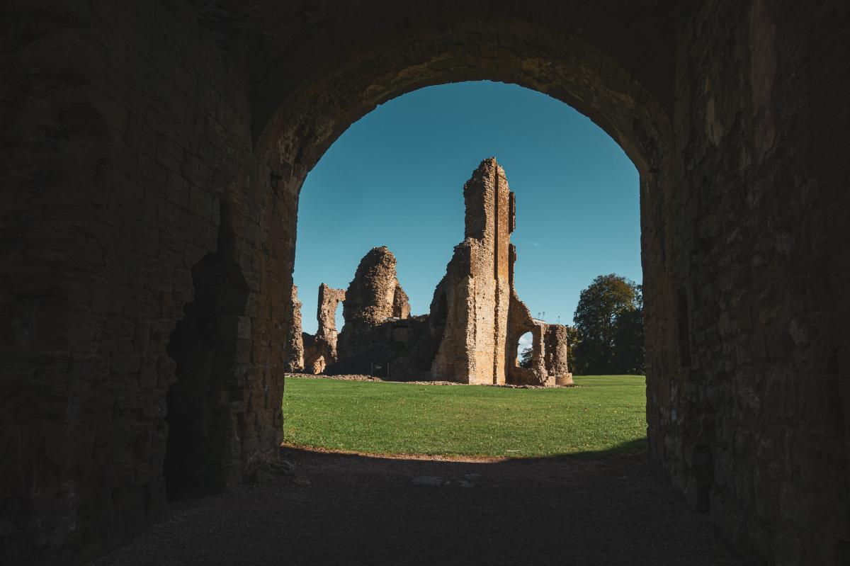 Looking through a walk way to the ruins of Sherborne Old Castle