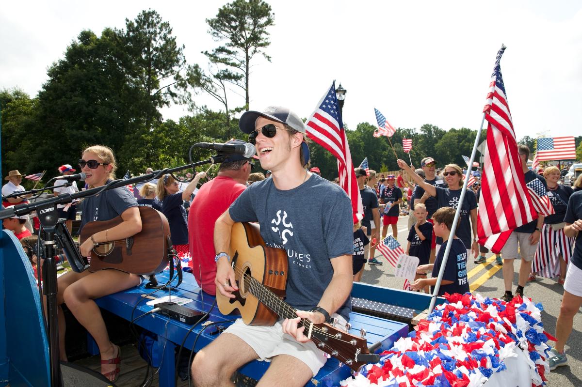 July 4th Parade Music Guy Playing Guitar and Singing