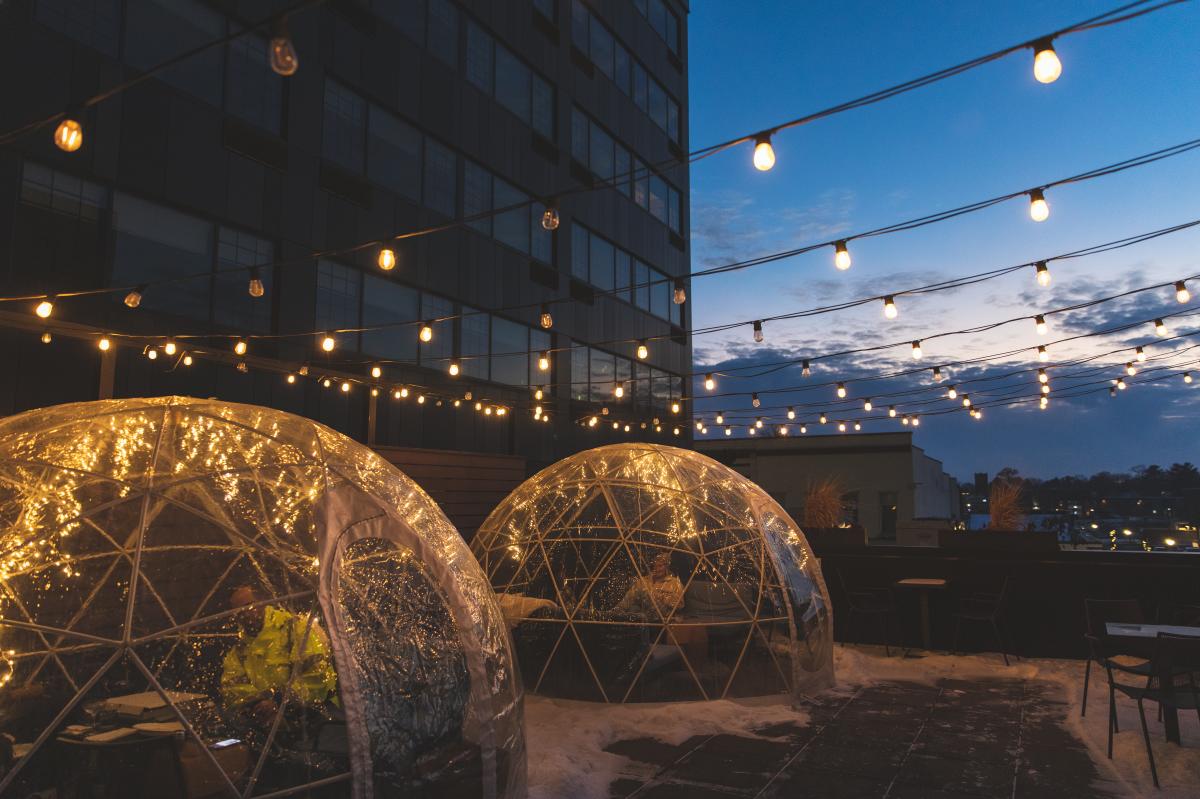 Two igloos on the Dive patio in the winter