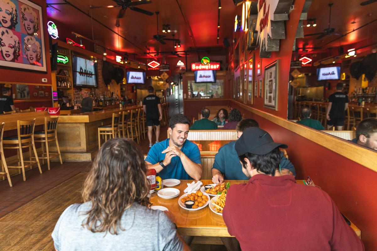 A group of men eating at Mogie's Pub on Water St. in Eau Claire, WI