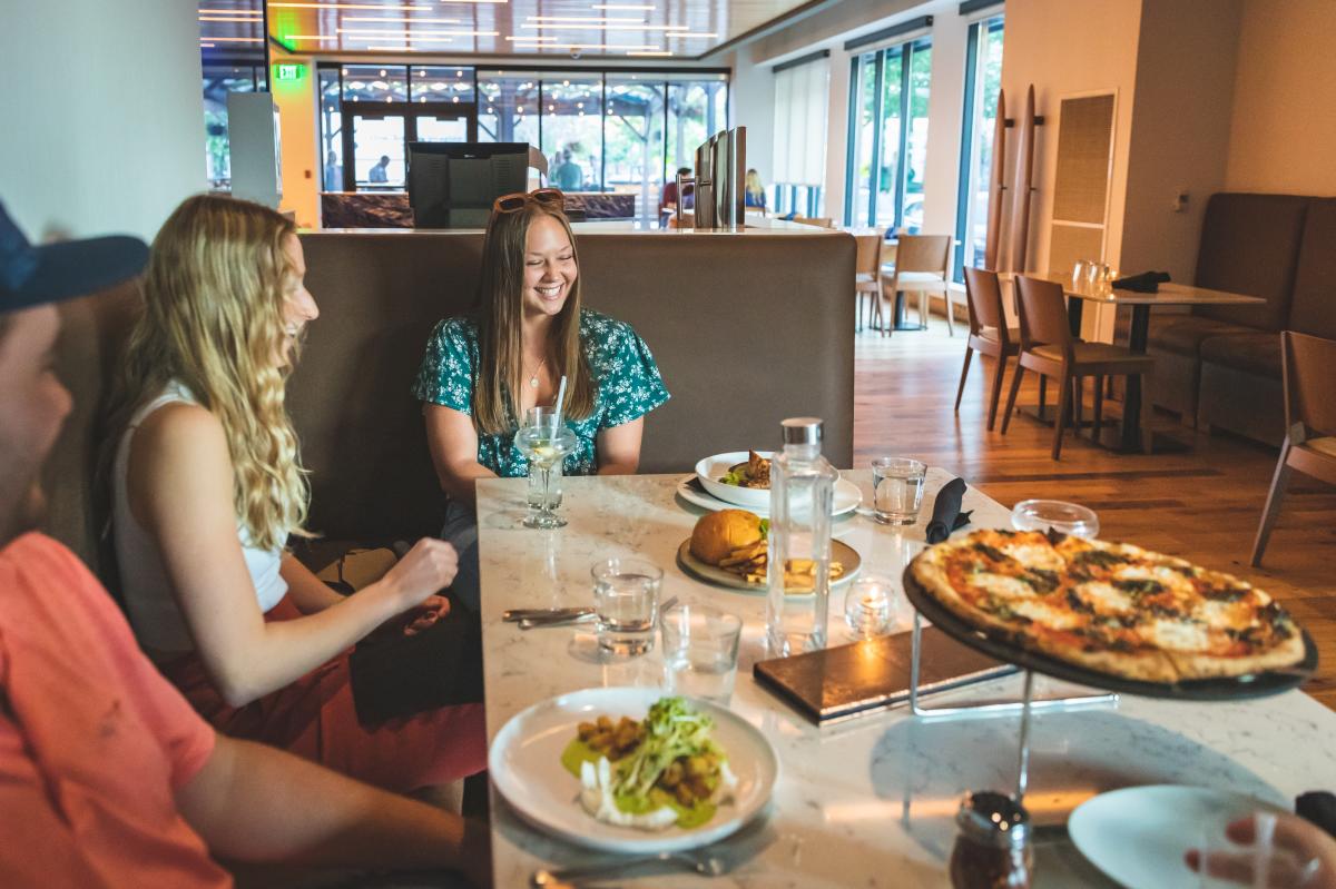 A group of friends having dinner at the Informalist