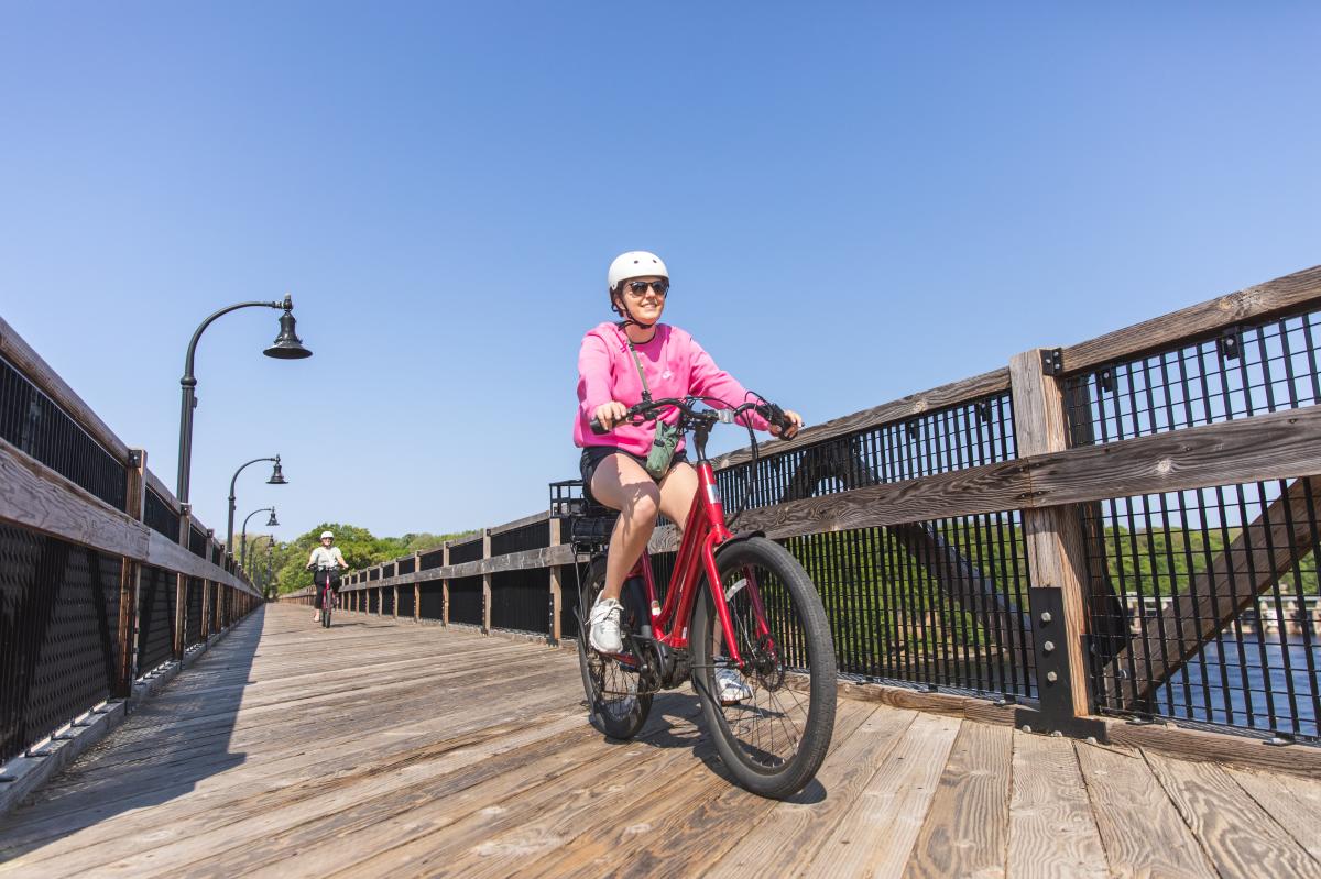 A girl riding an e-bike on the High Bridge