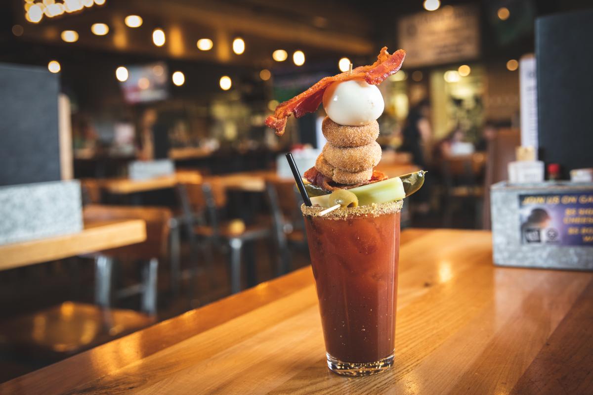 A Bloody Mary served with pickle, olive, mini donuts, hard-boiled egg and bacon at Northern Tap House