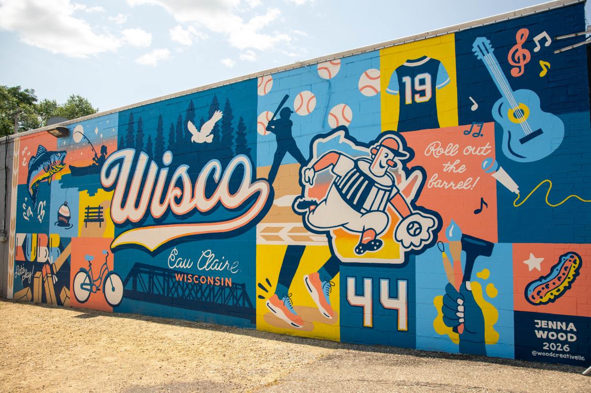 A color mural of Wisconsin-themed things on the side of The Pickle