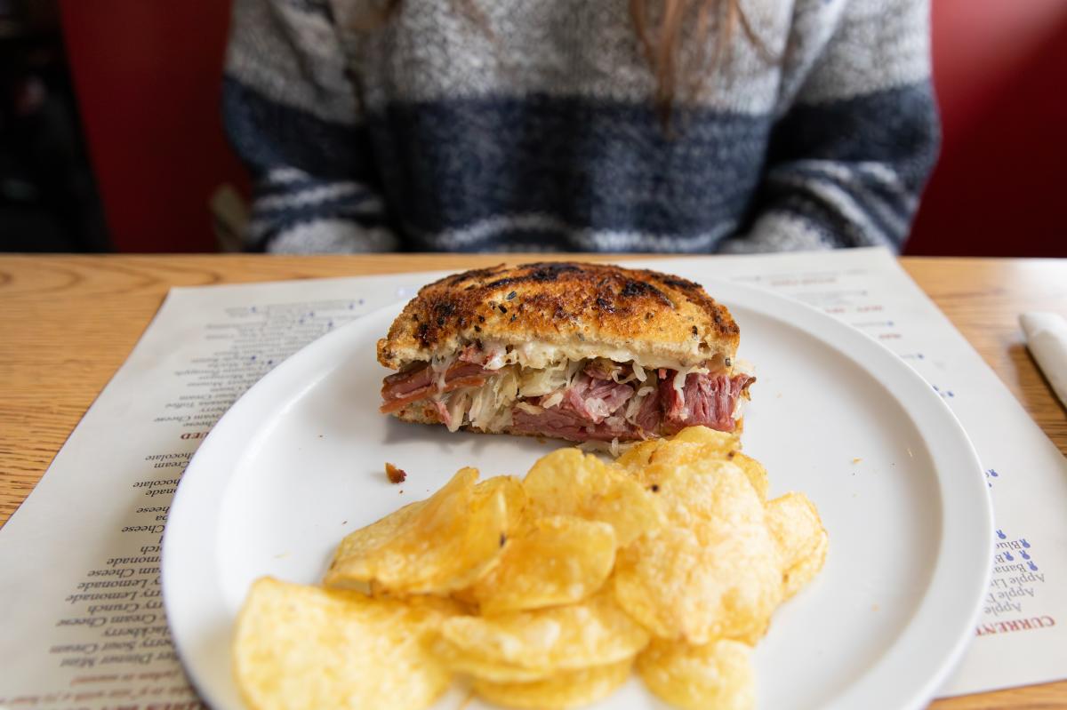 A plate with a Reuben and chips at Norske Nook
