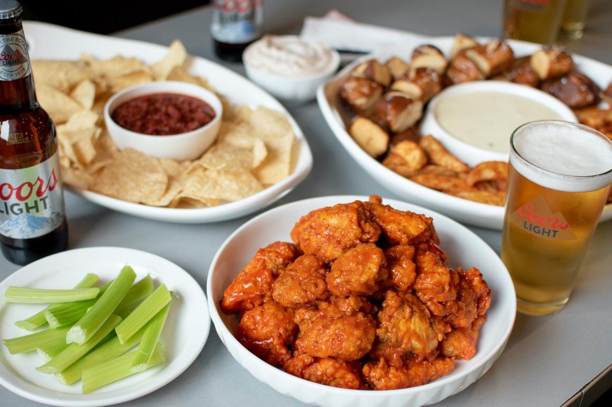 Bufalo Wings & Rings assortment of wings, appetizers and beer.