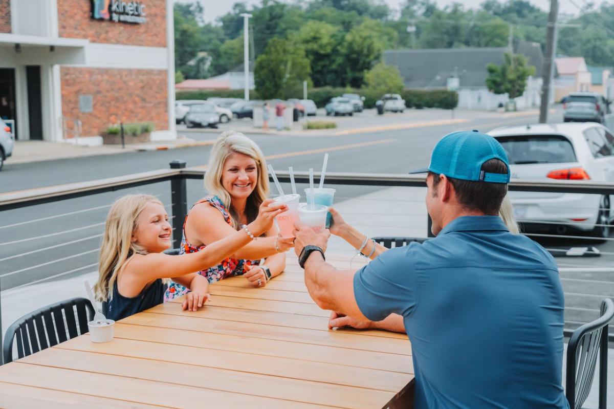 Family cheersing their sodas at Kuddy's Sips and Sweets in Downtown Elizabethtown, KY