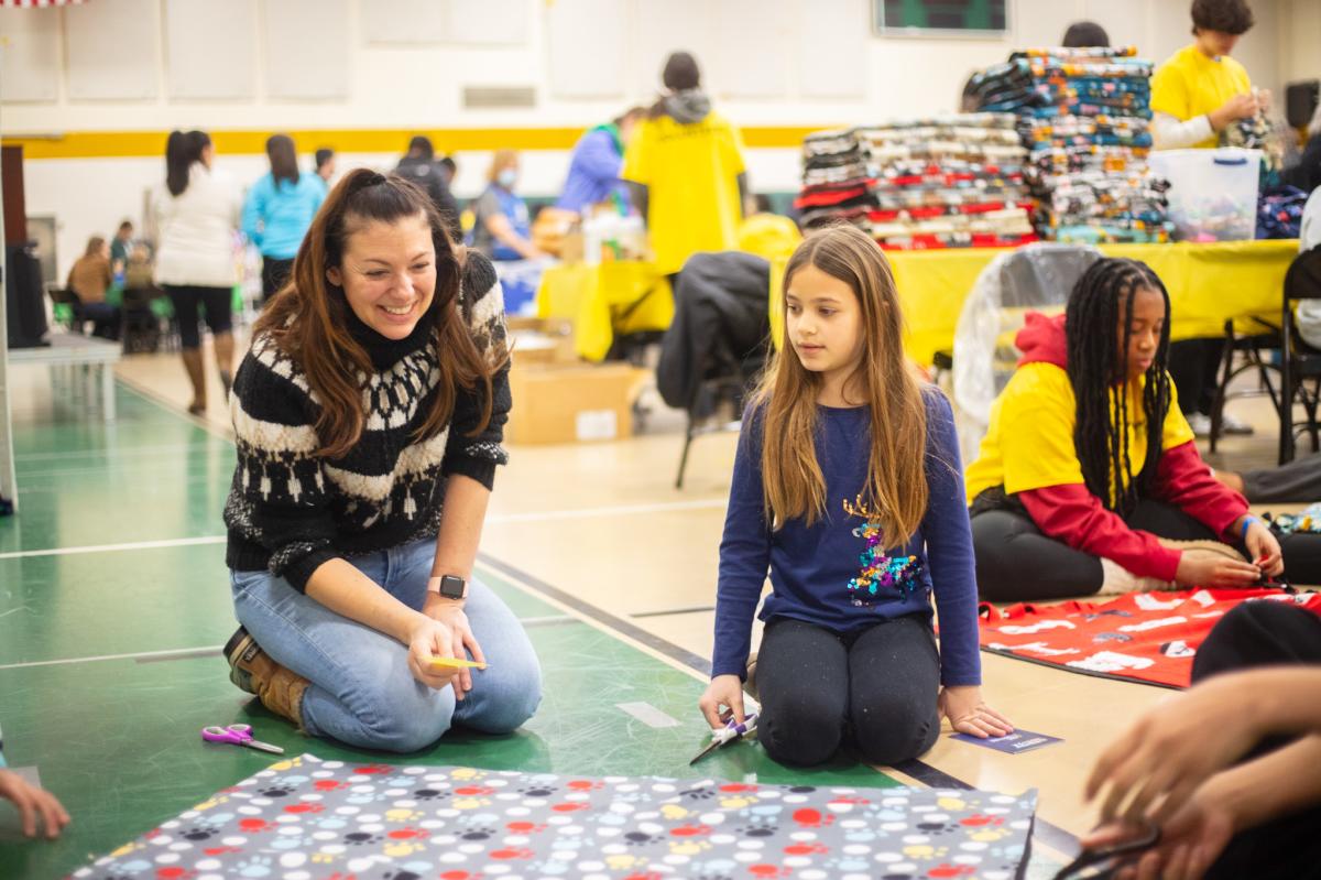Adult and kid working on a project together