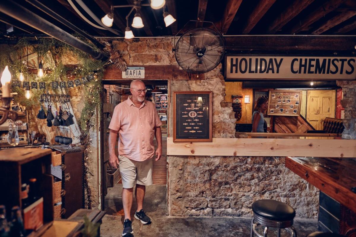 A person browsing an antique store.