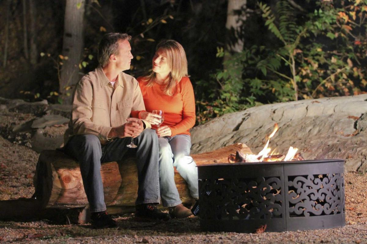 Couple Sitting by Fire with Wine