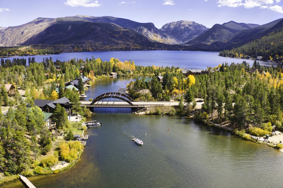 A fall aerial view of Grand Lake, the Channel and rainbow bridge
