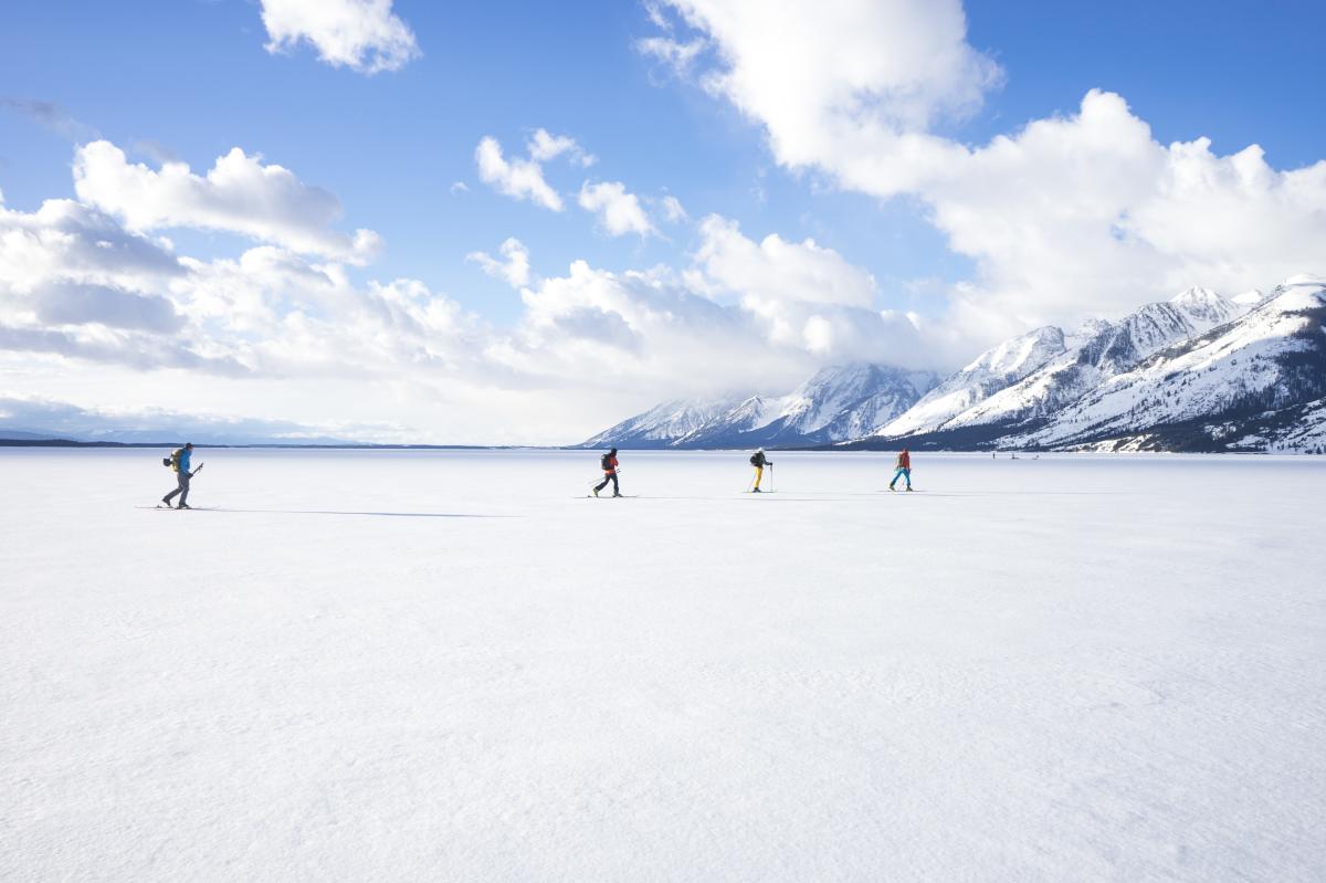 snowmobilers walking trail