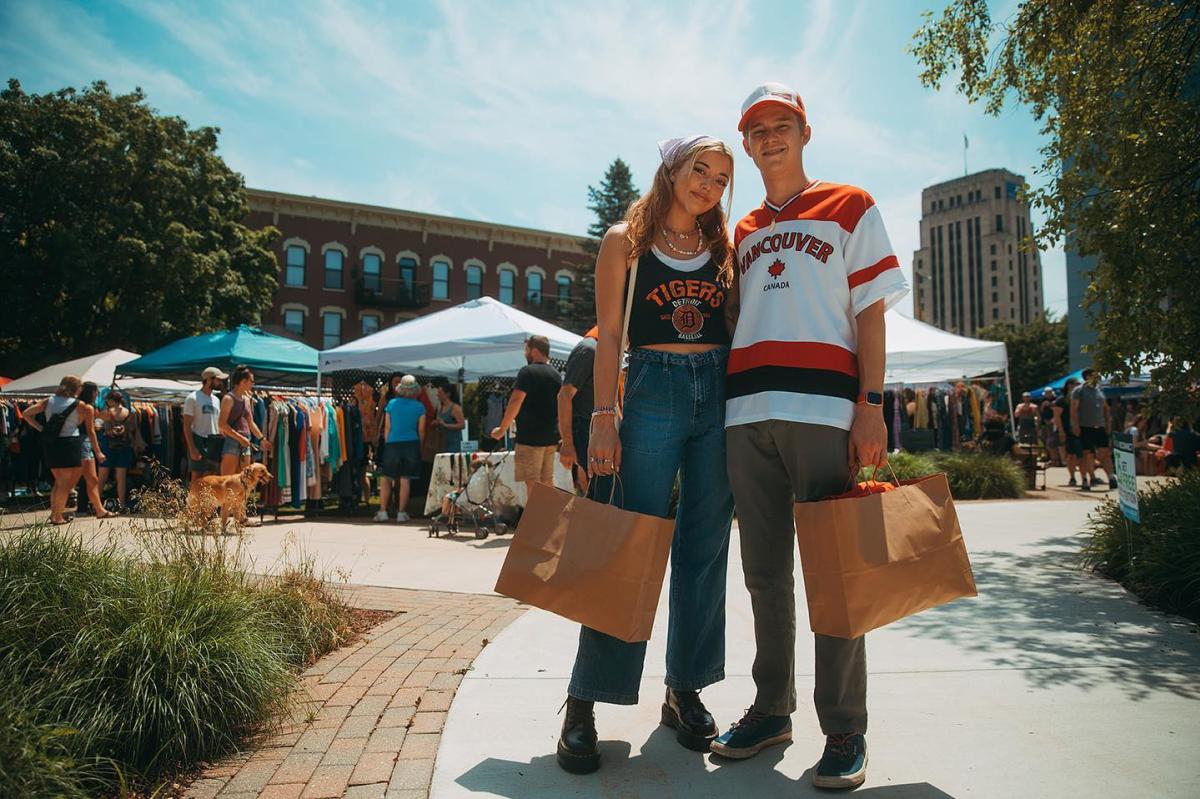 A couple holding shopping bags