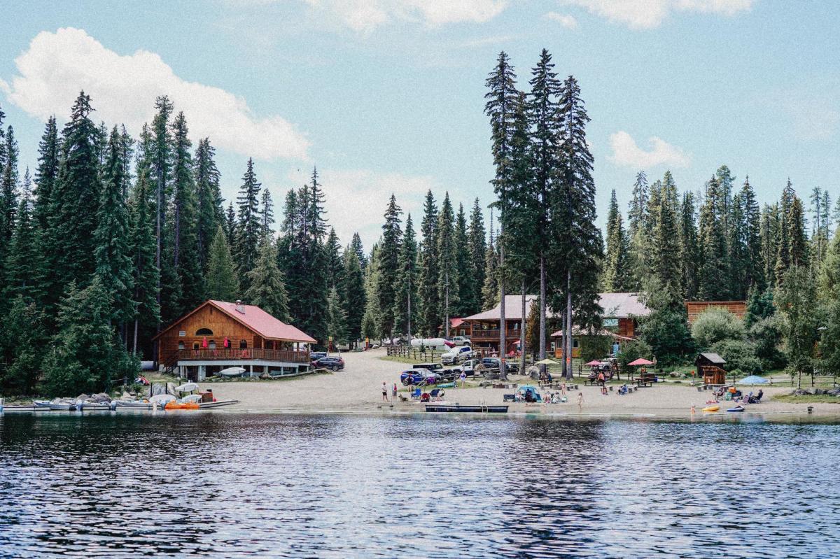 Beaver Lake Resort Shoreline with Cabins Beach and People by the Water
