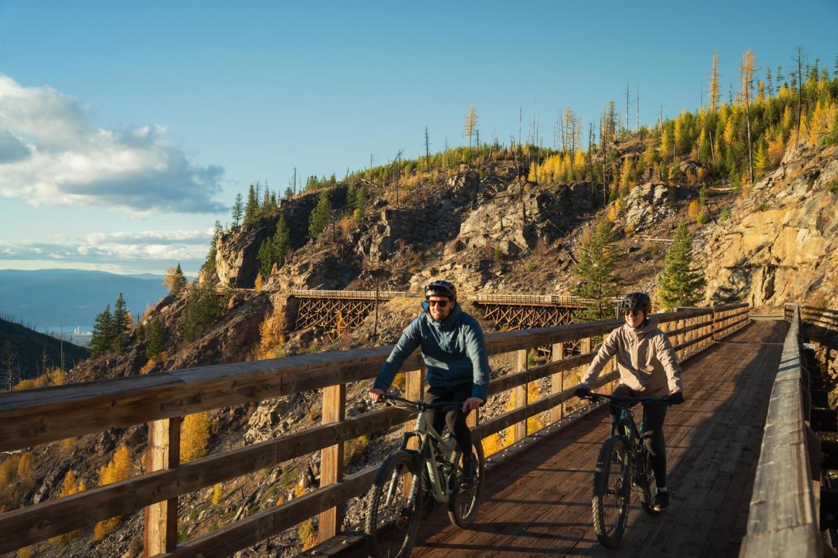 Couple Biking at Myra Canyon Trestles during Golden Larch Season 9