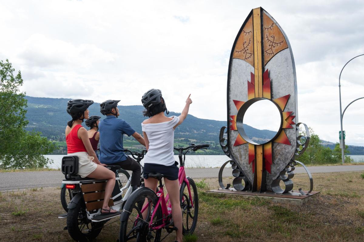 Family Viewing Indigenous syilx Artwork along Okanagan Rail Trail