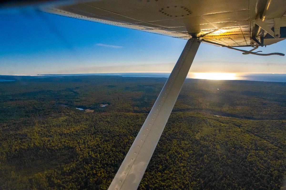 view of a fall landscape from the window of a seaplane