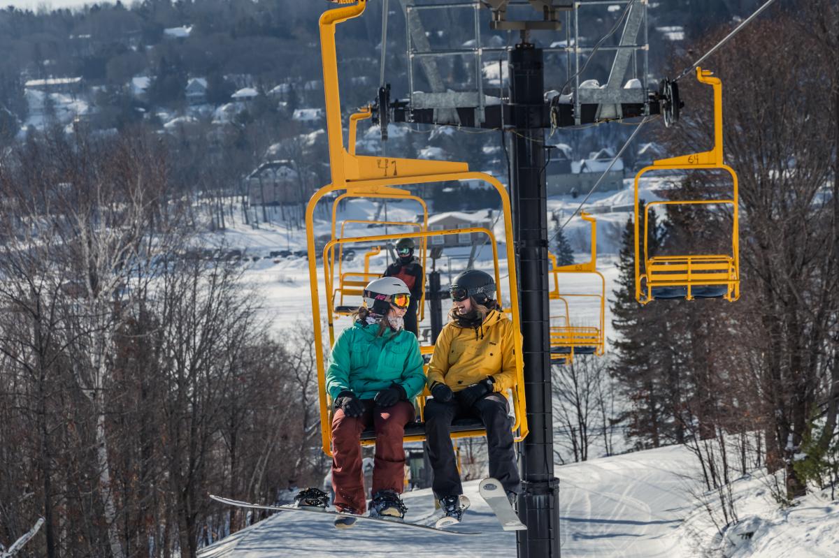 Riding the lift at Mont Ripley