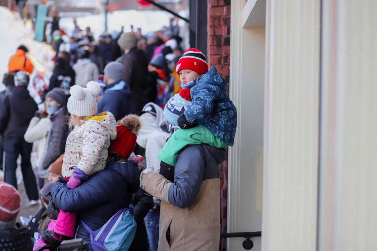 small children watch an outdoor event