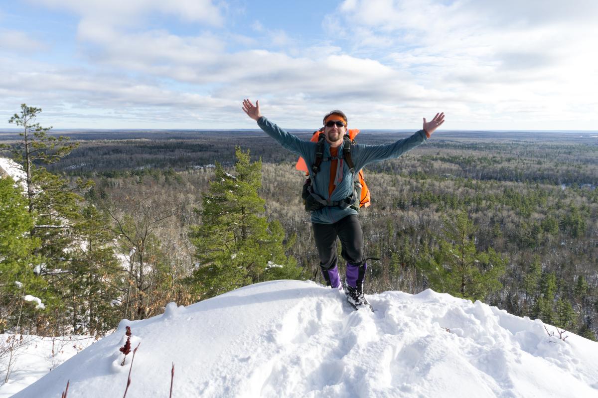 Nathan Miller can be seen atop Norwich Mountain.