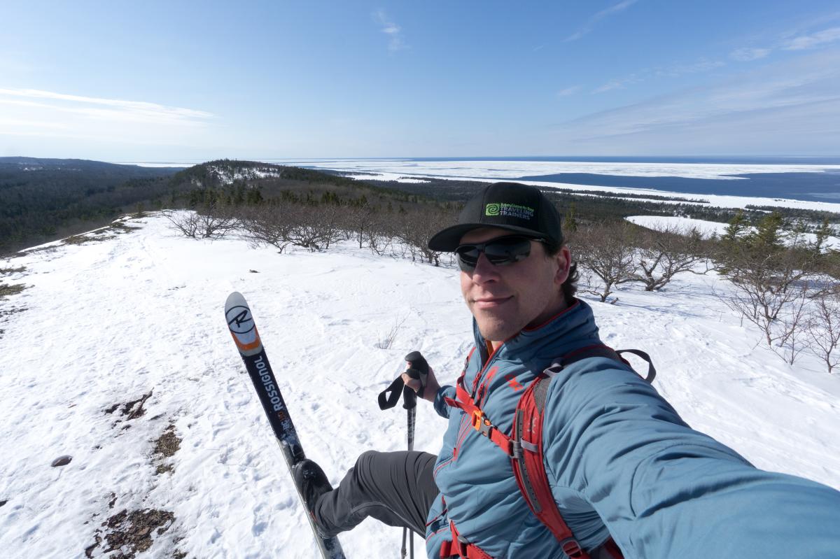 Man takes selfie atop Mt. Baldy with his skis.
