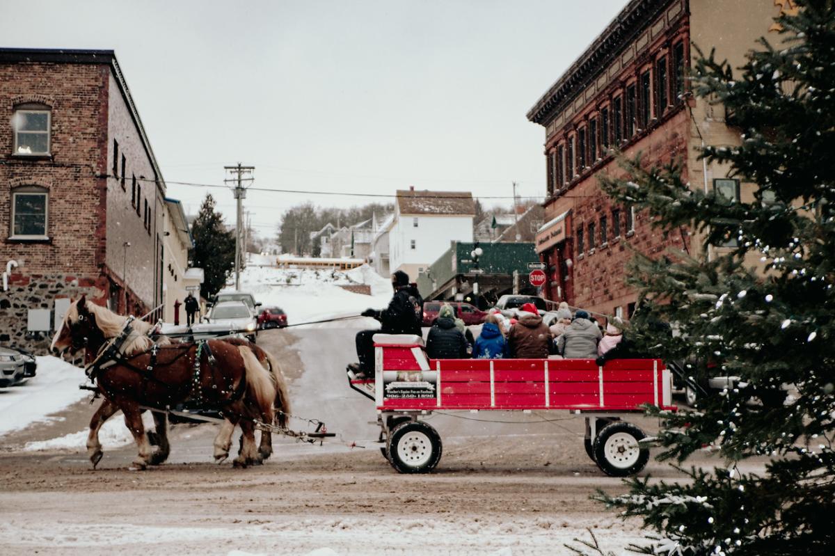 Rustic horse-drawn carriage on historic Keweenaw streets.
