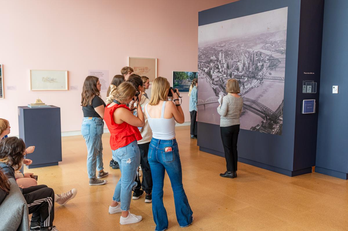 Students look at The Golden Triangle in 1947,” a large vinyl print by John R. Shrader for Swoger Studio as part of “Frank Lloyd Wright’s Southwestern Pennsylvania,” at The Westmoreland Museum of American Art in Greensburg.