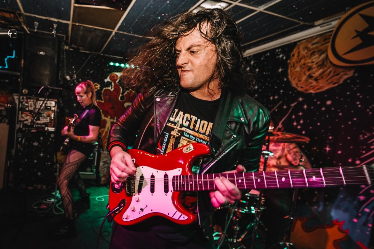 Photo of musician Greg Wheeler playing Guitar at the Replay Lounge in Lawrence, Kansas