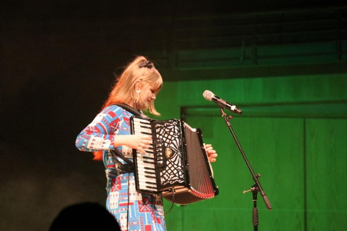 Person playing instrument on stage at WOMEX