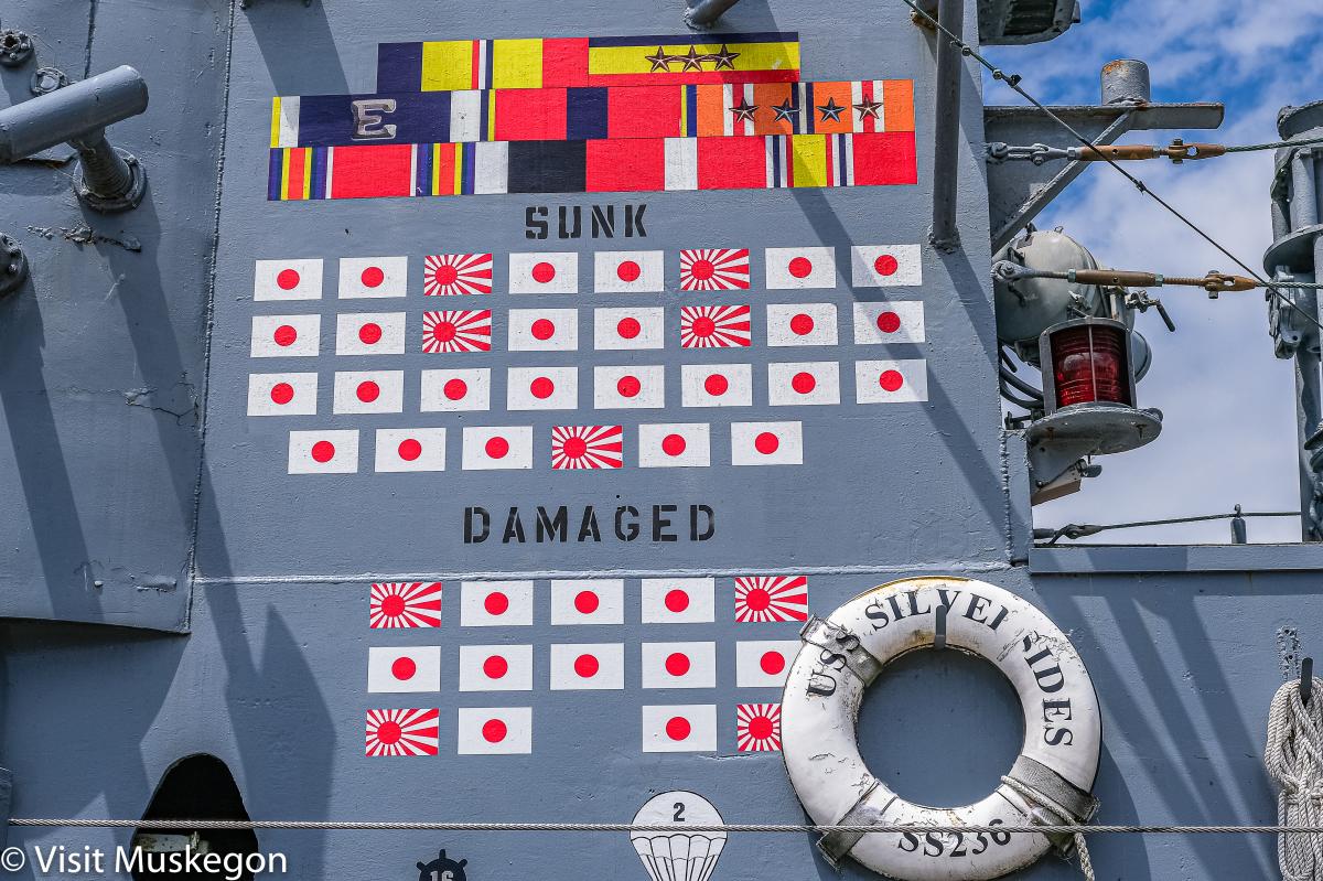 Side of USS Silversides Submarine shows flags of ships she sank or damaged during WW2