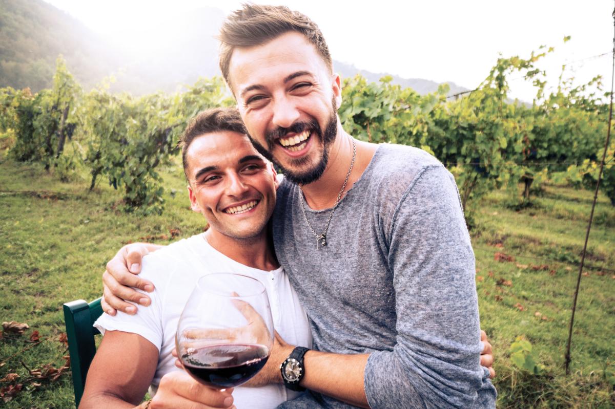 Men drinking wine in a vineyard