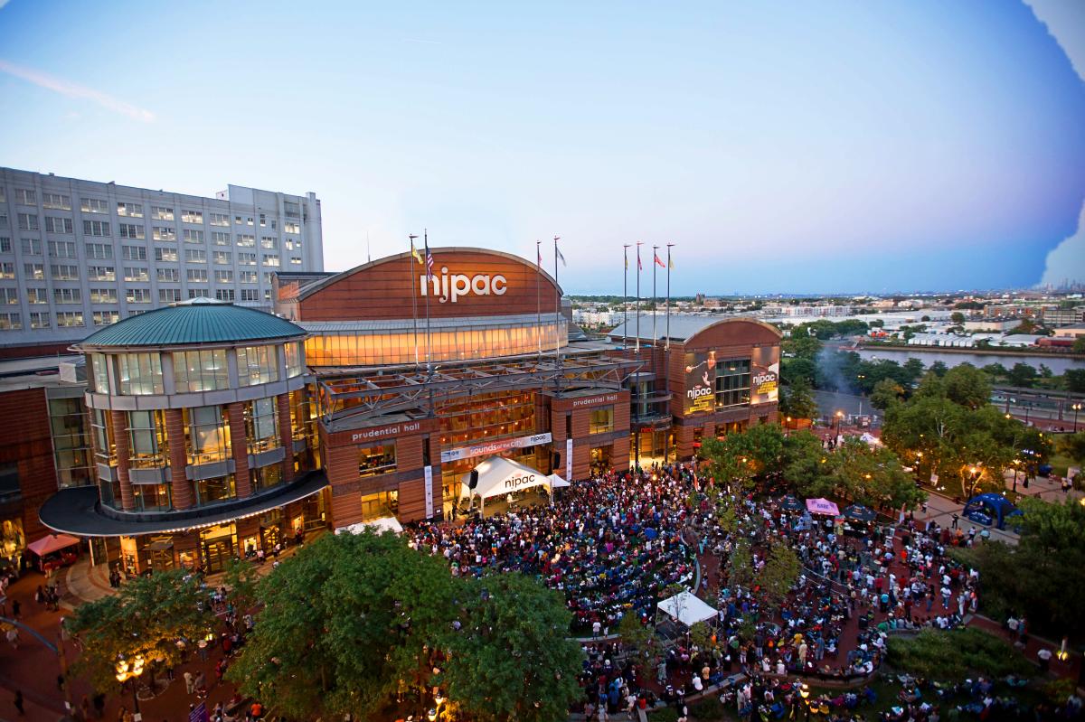 A crowd gathers outside the New Jersey Performing Arts Center in Newark, NJ