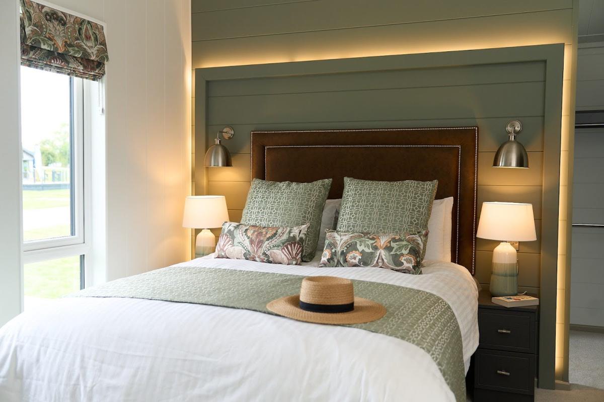 Interior of bedroom in lakeside lodge at Green Hill Farm Holiday Village