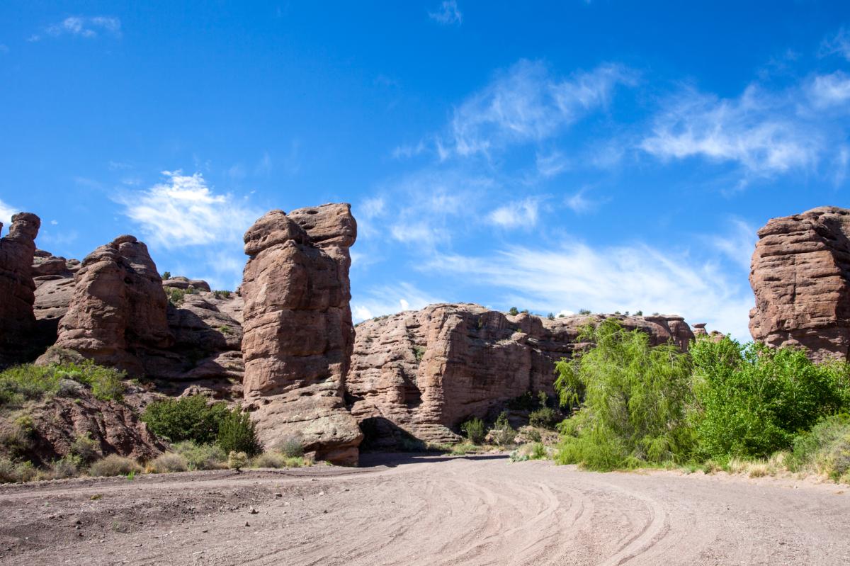 Scenic view of the rugged rock formations under a bright blue sky.