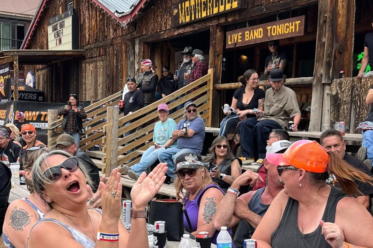 People hanging out outside the Motherlode Saloon in Red River.