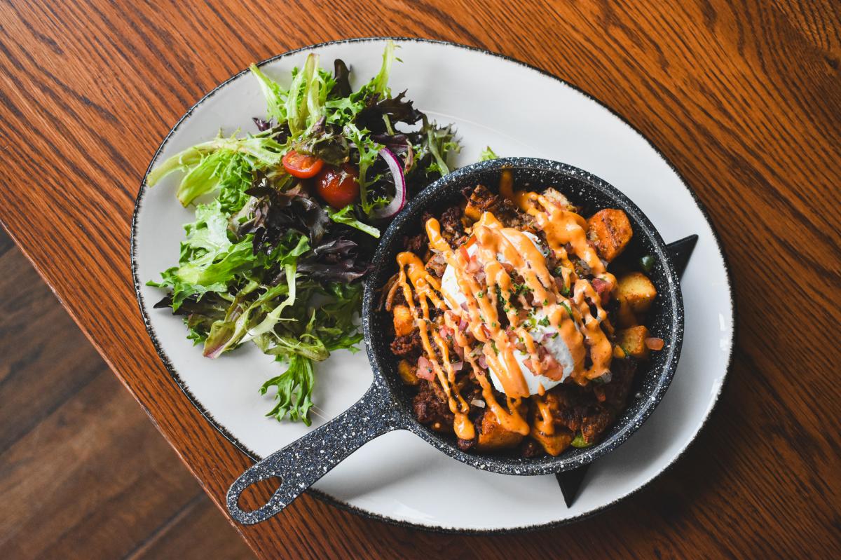 A plate of food offered at Dynamite Woodfire Grill.