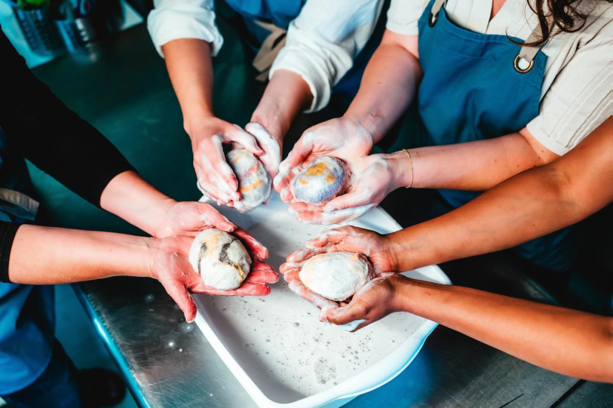 People creating soap souvenirs