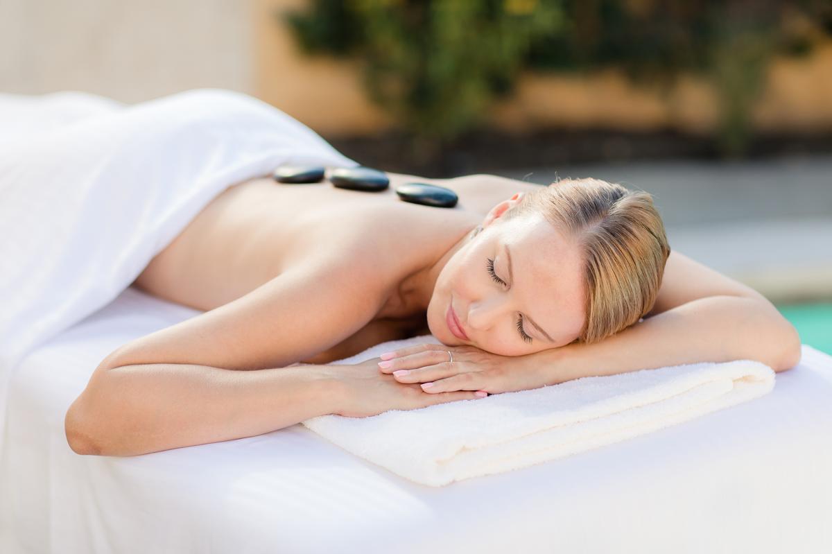 Woman enjoying hot stone massage at Miramonte Indian Wells Resort and Spa