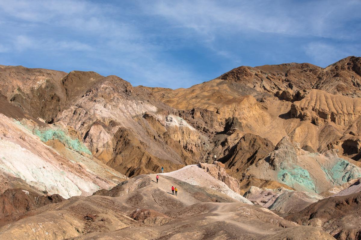 Hikers in Artists Palette in Death Valley National Park in California