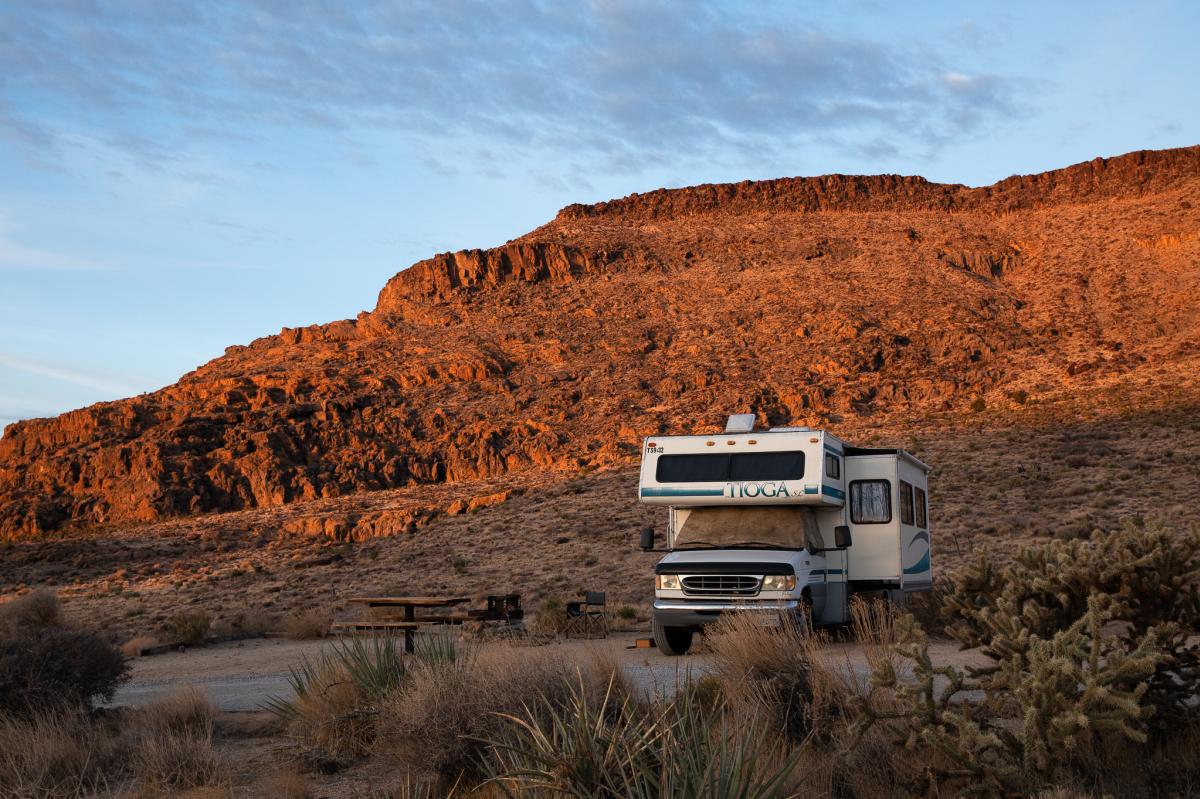 An RV parked at a campsite at Hole-in-the-Wall Campground in the Mojave National Preserve