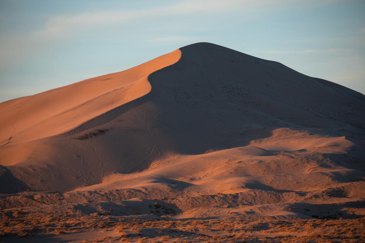 Hiking below the Kelso Dunes at sunset in the Mojave National Preserve