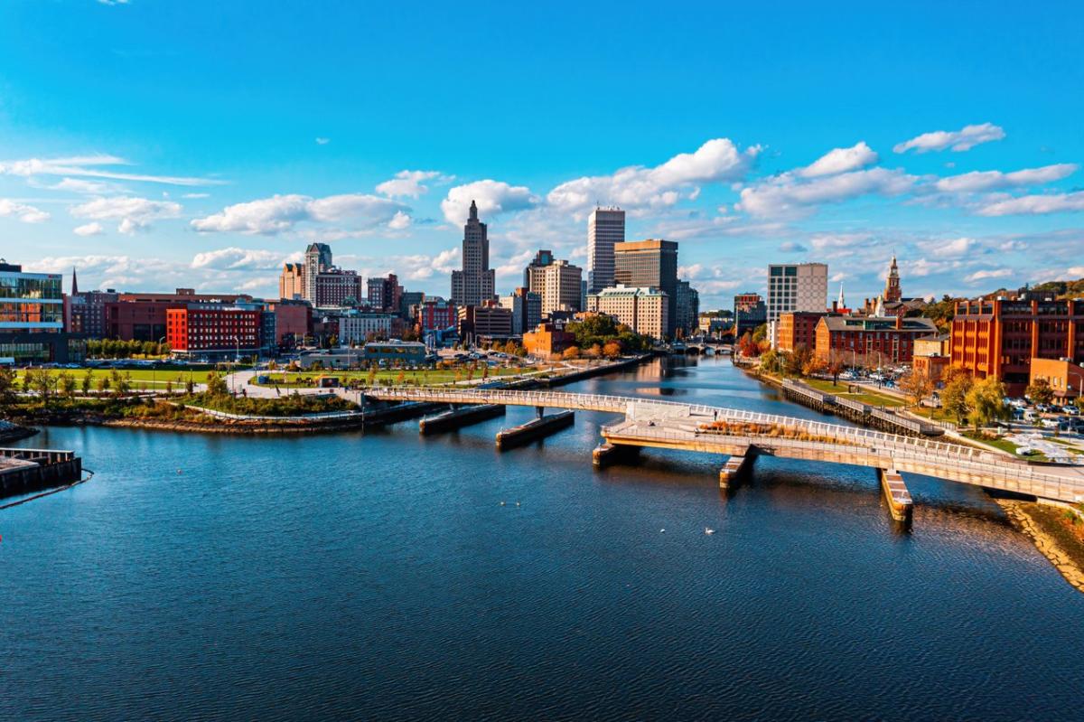 The Providence River Pedestrian Bridge spanning the Providence River with the Providence skyline in the background.