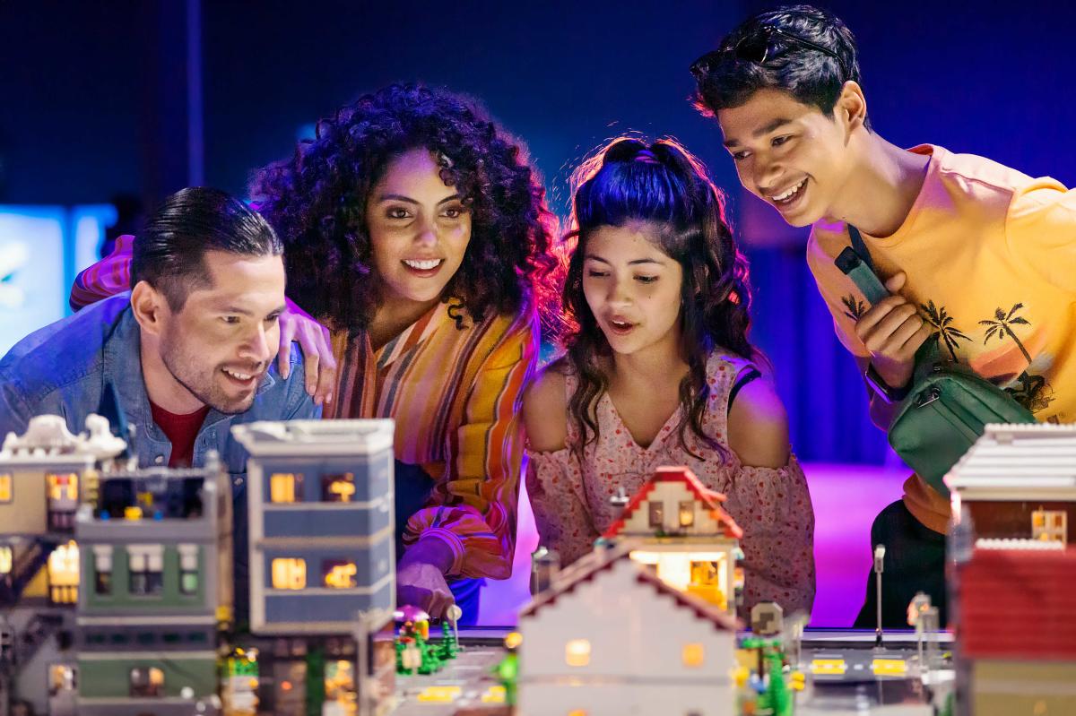 Family looking at Tech Port San Antonio exhibit