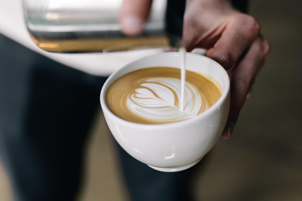 Pouring cream design in coffee