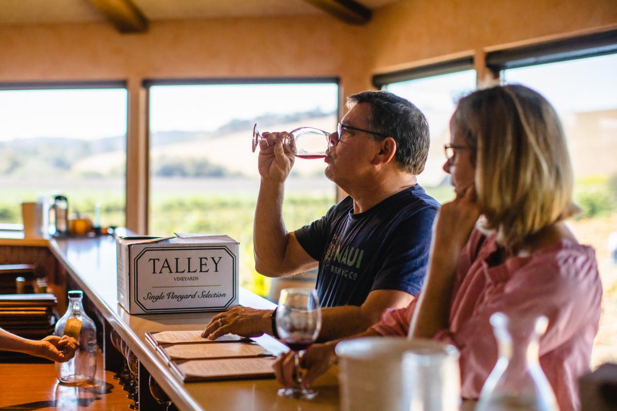 Couple tasting wine in a tasting room