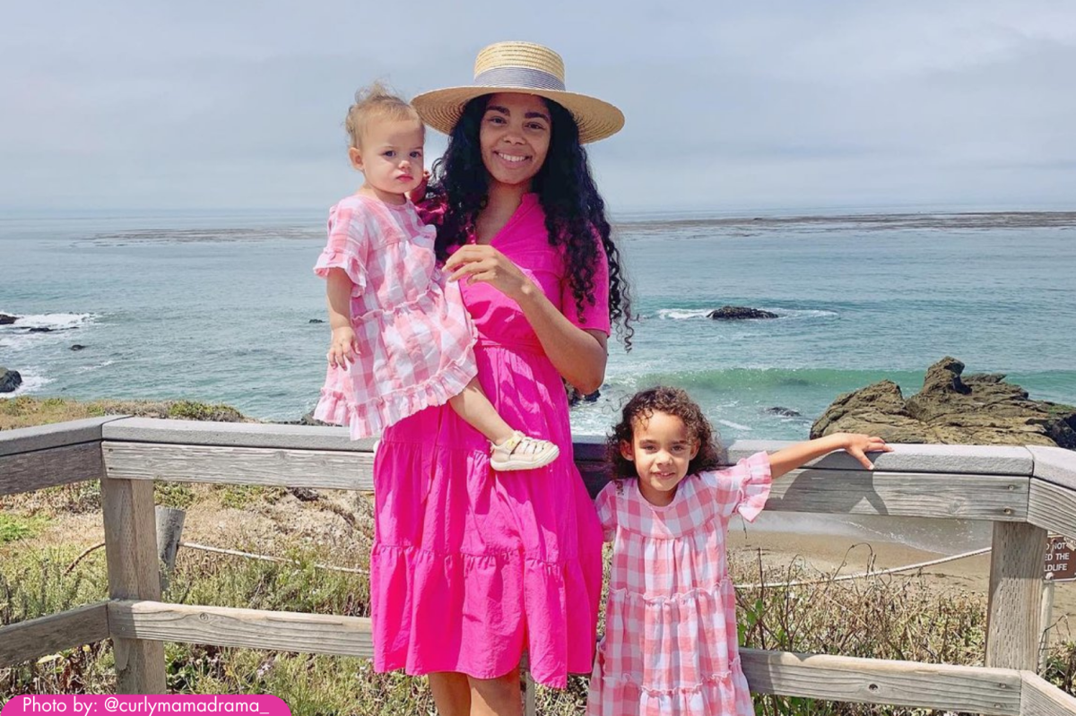 Mother and daughters standing by the ocean at Cambria