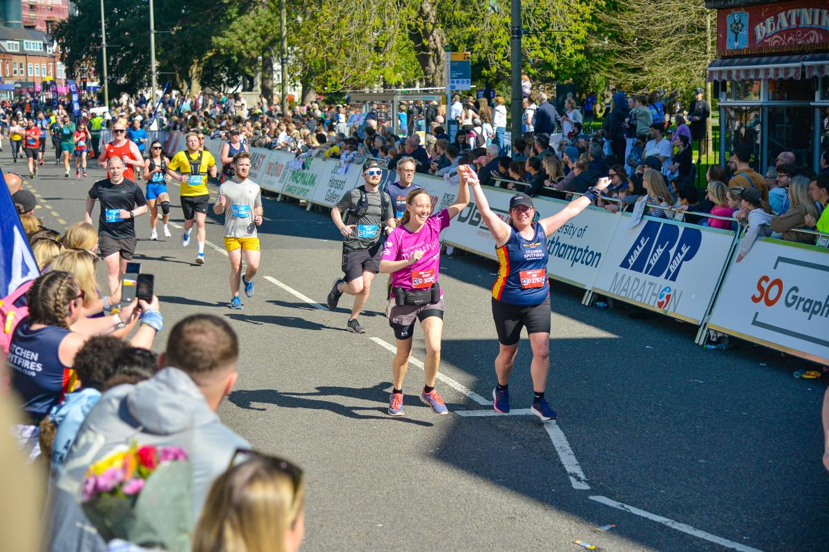 Runners running along Above Bar Street for ABP Marathon