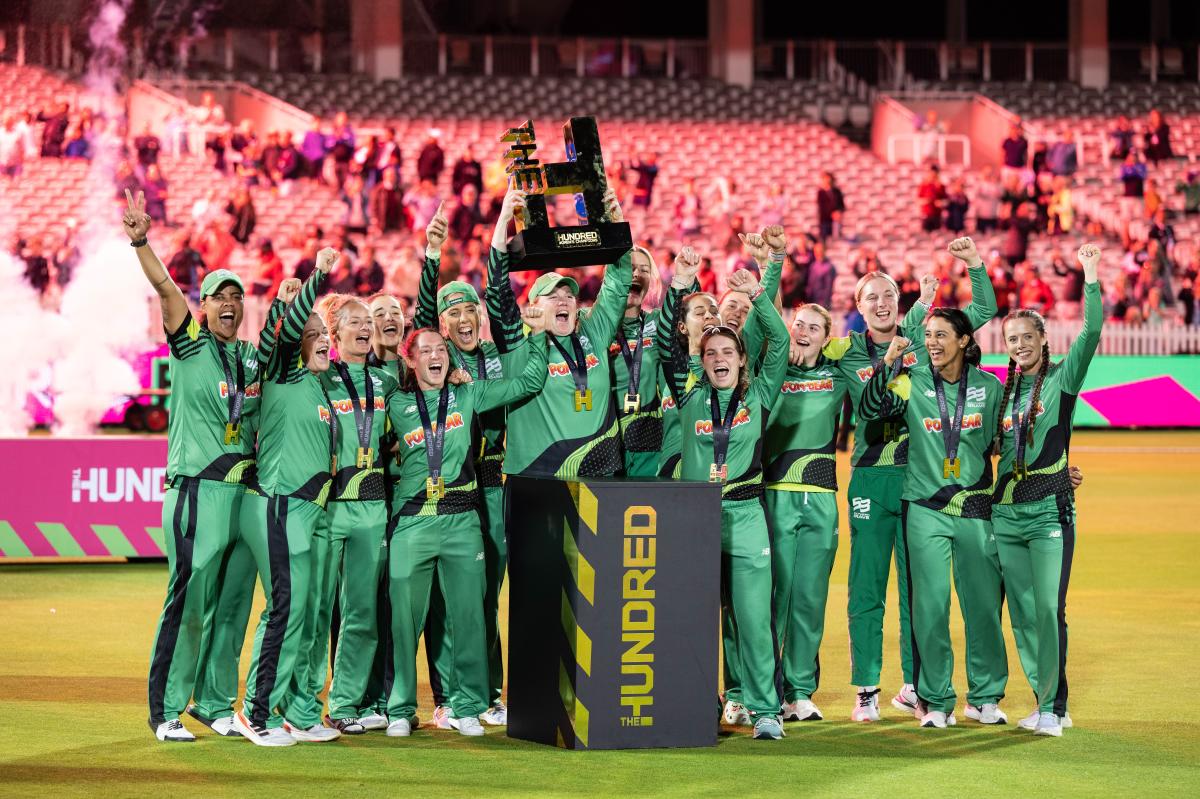 Southern Brave women's team holding up trophy at The Hundred