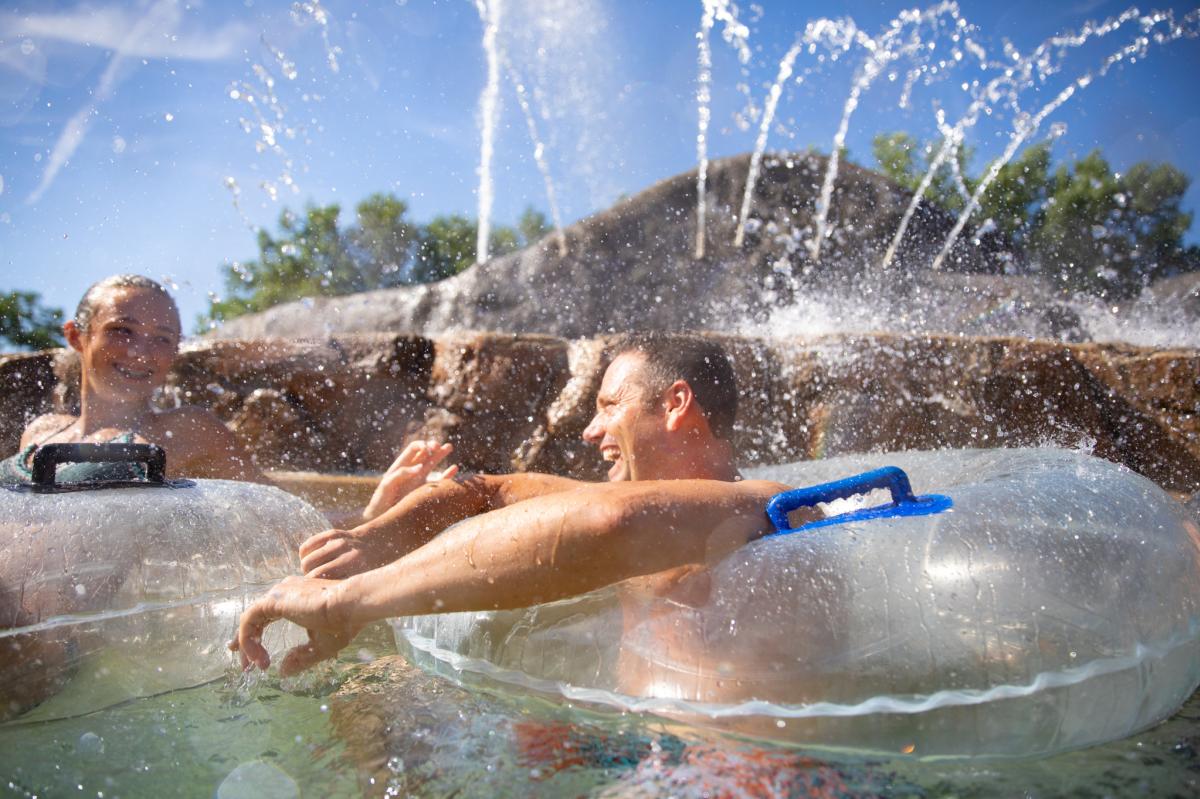 Family relaxing on tubes on the adventure river at Noah's Ark.